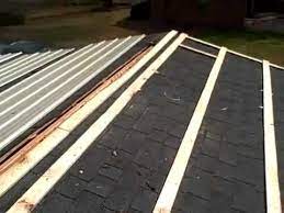 Begin laying the metal sheets from the bottom to the top of the roof. Metal Roofing Over Shingles Diy Metal Roof Roofing Diy Corrugated Metal Roof