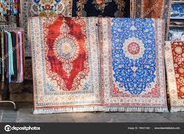 two colorful silk carpets and rugs at