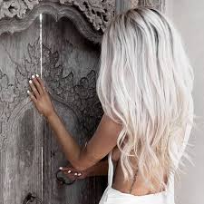 Blonde highlights is a hair coloring technique that adds streaks of blonde color to a darker base hair color. Picture Of Long Icy Blonde Hair Looks Ideal With Tanned Skin And White Nails