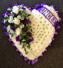 A beautiful gesture for this sensitive moment. Purple And White Heart Buy Online Or Call 01206 843461
