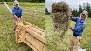 farmer uses homemade hay baler you