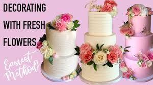 a cake decorate with fresh flowers