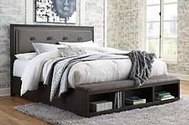 This is a very sturdy frame made from wood and metal legs. Beds Ashley Furniture Homestore