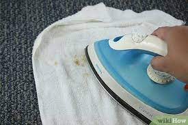 remove a carpet stain with an iron