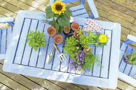 Once you've stripped the table back to bare wood, change the sandpaper to a finer grit, such as 240 grit. It S Time To Spruce Up Wooden Fences And Garden Furniture