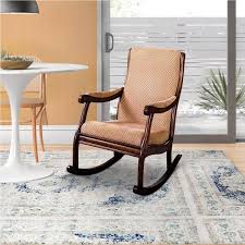 beige fabric upholstered rocking chair