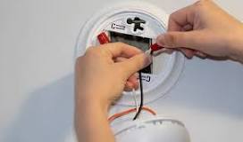 How do you wire multiple smoke detectors?