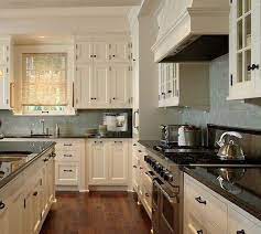 cream kitchen cabinets with grey walls