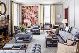 Since your living room is your couch's home, it's the most natural place for an accent chair to cozy up. How To Incorporate Ottomans Into Your Living Room Decor Architectural Digest