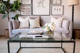 The tv set is on a little table in the corner of the room. How To Style A Coffee Table The Everygirl