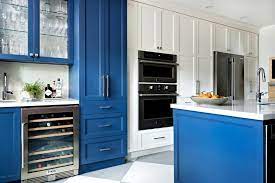 Crafted from manufactured wood in a navy blue hue, this piece features a traditional cabinet front with three drawers and three doors adorned by a decorative wood design on their glass fronts. Blue Kitchen Ideas Blue Cabinets And Blue Kitchen Decor Carpet One Floor Home