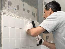 tiling a shower floor or wall first