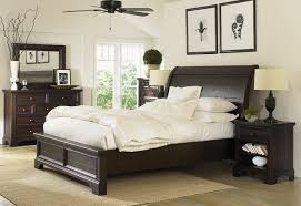 neutral bedroom with dark wood