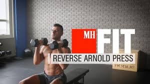 Learn proper arnold press form with step by step arnold press instructions, arnold press tips, and the arnold press technique video on this page. Build Bigger Shoulders With The Reverse Arnold Press Men S Health