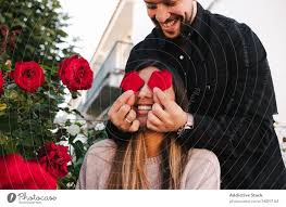 romantic couple having fun with flowers