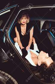 Beautiful Young Woman Undressing Handsome Man In Car Stock Photo, Picture  and Royalty Free Image. Image 128145666.