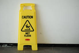 wet floor sign legally required by law