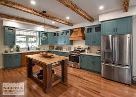 teal farmhouse kitchen with wood
