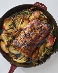 juicy pork roast with apples and onions