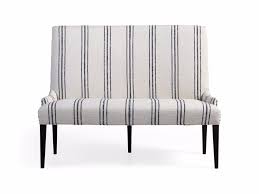 This bench is durably constructed from laminated wood and topped with a polyester cushion for comfort. Platinum Dining Bench Arhaus