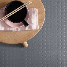 dark grey studded rubber flooring tiles