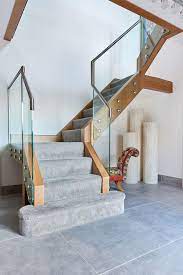 Modern helical staircases with curved glass railing and glass steps, stainless steel stringers. Glass Staircases Contemporary Modern Jarrods