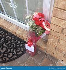 Flowers on doorstep editorial photography. Image of boquet - 49813617