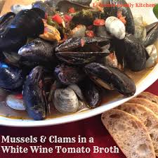 clams in a white wine tomato broth