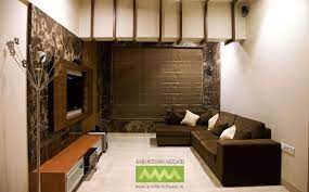 Located in byculla, the ficus fine living luxurious furniture store in mumbai offers home decor with a touch of class and elegance. Large Living Room With Brown Sofas Design By Anish Motwani Associates Interio Indian Living Rooms Living Room Tv Cabinet Designs Furniture Design Living Room