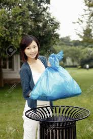 1 throw away put into the rubbish bin e.g. Woman Throwing Rubbish Into Garbage Bin Stock Photo Picture And Royalty Free Image Image 85735852
