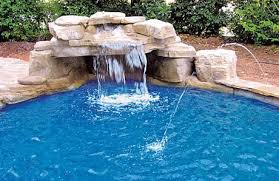 The waterfall pours off the top of the rocks, and down into the pool. Pool Grottos Cool Design Ideas Cost More Pool Research