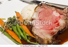 Both boneless and standing rib roast are flavorful, tender, and delicious, but i decided to go with the roast with bones. Prime Rib With Vegetables And Potatoes A Slice Of Rare Roast Beef With Whole Baby Carrots Green Beans Garnished With Canstock