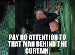 man behind the curtain