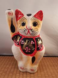 The solid curled up cat is reminiscent of a japanese netsuke. Paper Maneki Neko Cat Ryan Snooks Collection Of Japanese Asian Decorative Art