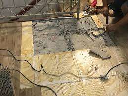 repair floor tiles that popped up