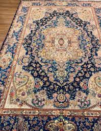 two identical rare silk persian rugs