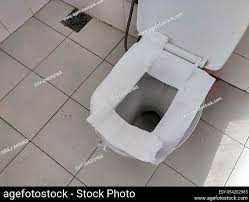 Toilet Paper Put On Open Toilet Seat