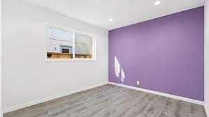 75 gray floor bedroom with purple walls