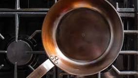 What is the best way to season a carbon steel pan?