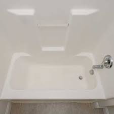 a fibergl tub and shower surround
