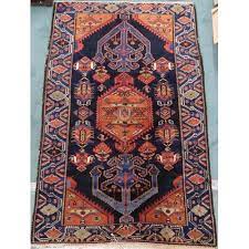 a dark blue ground hamadan rug with