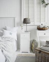 The patterns and soft colors on the rugs add a little bit of variety to this room. White Bedroom Furniture The White Lighthouse