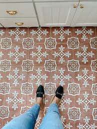 stick tile over the bathroom floor