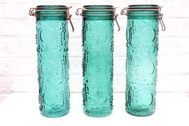 The unique large glass apothecary jar with lid and stand is a statement maker that's perfect for a candy buffet table all on its own but you can create a custom set by mixing and matching the clear glass container with our other decorative. Reserved Ramu 2 Vintage Turquoise Green Glass Storage Jar Embossed Fruit Pasta Container Spaghetti Holder Wire Bail Lids Emerald Glass Storage Glass Storage Jars Jar Storage