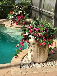 Maybe you would like to learn more about one of these? A Florida Pool Container Planting Of Assorted Outdoor Artificial Flowers And Greenery Custom De Potted Plants Patio Artificial Flowers Landscaping Around Pool