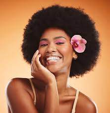 face beauty and black woman with flower