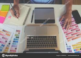 Graphic Design And Color Swatches And Pens On A Desk