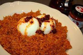 Serve in an egg cup by placing the egg in the cup with the small end down. Jollof Rice And Boiled Egg Nigerian Food Food Jollof Rice