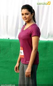 Photoshoot by lifestyle magazine vanitha has gone viral with more than 10 lakh views on facebook. Manju Warrier Hot In Tight T Shirt