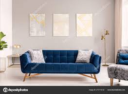 blue velvet sofa gold stock photo